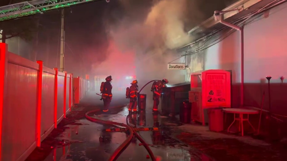 Firefighters work to put out fire at Coastal Christian Church.