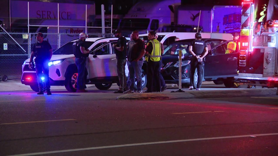 Investigators next to a crash involving a TPD patrol vehicle.