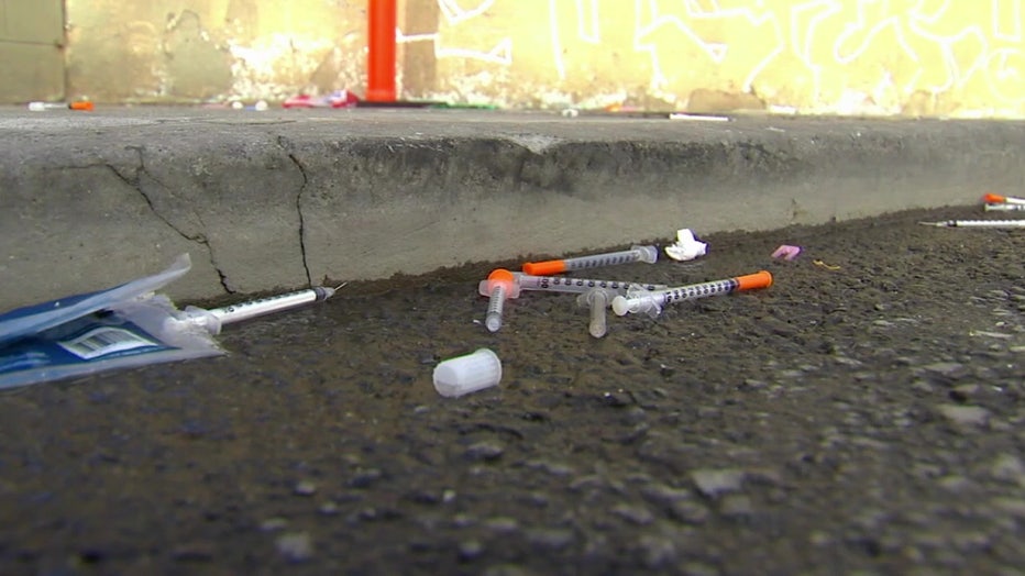 File: Discarded needles on ground.