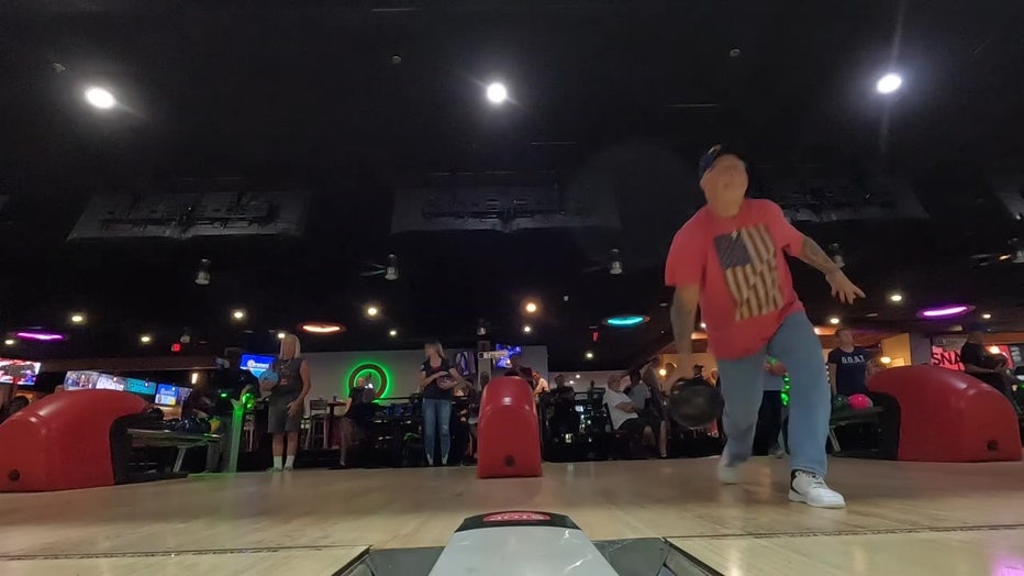 A man bowls as part of the Veterans and First Responders Bowling League. 