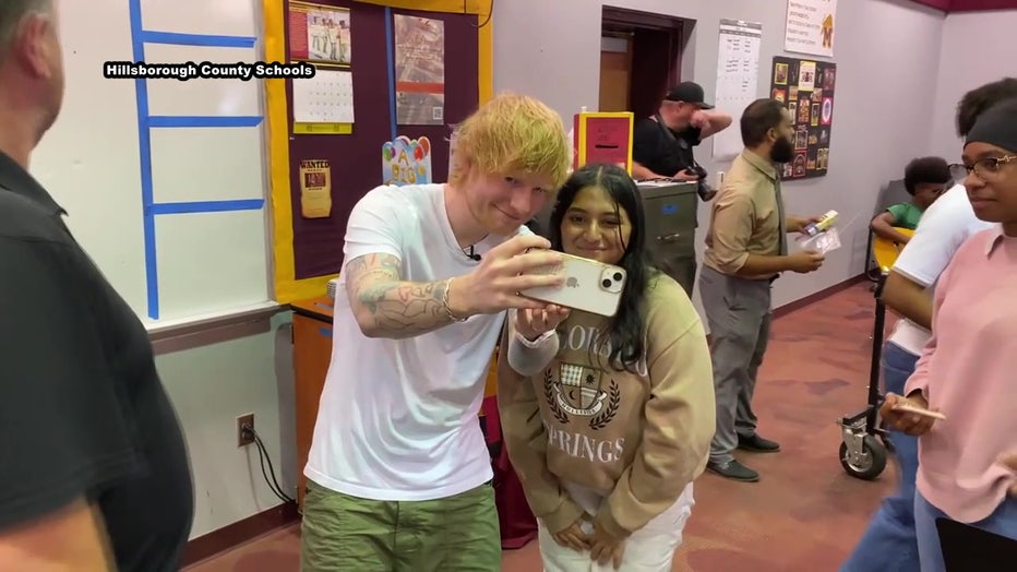 Ed Sheeran took selfies with the students. 