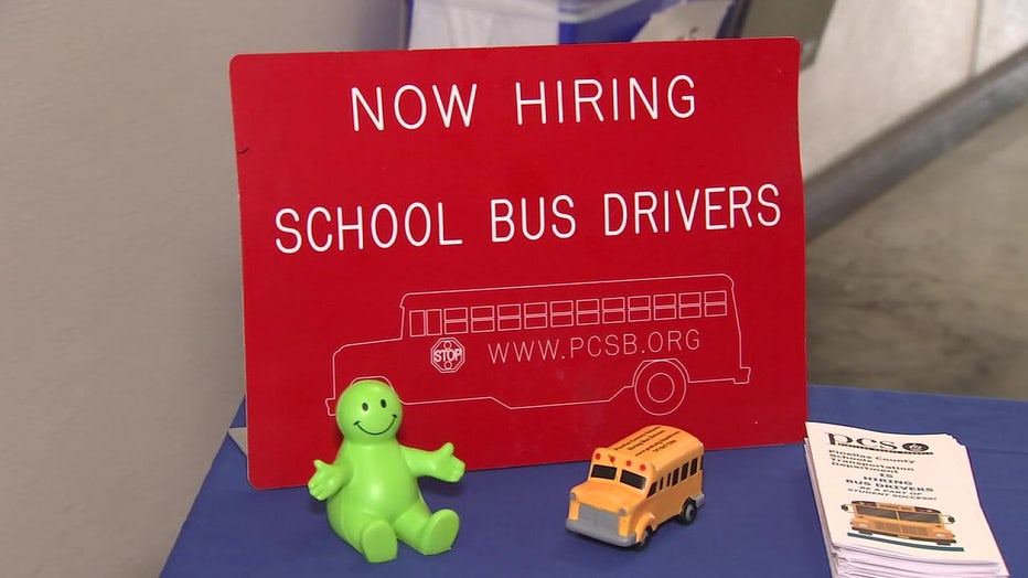 Now hiring school bus drivers sign. 