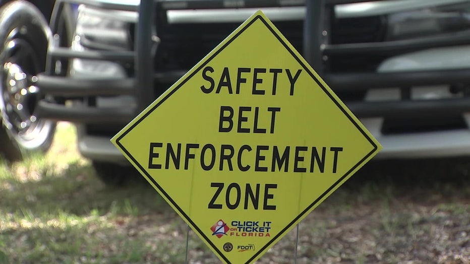 Seat belt enforcement sign. 