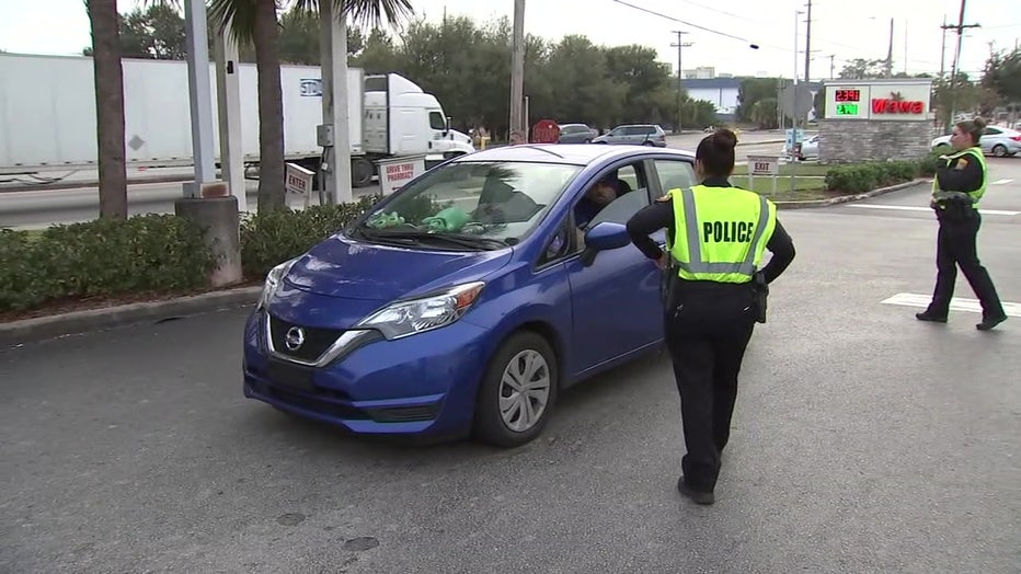 A police officer approaches a driver during the 'Click It or Ticket' campaign. 