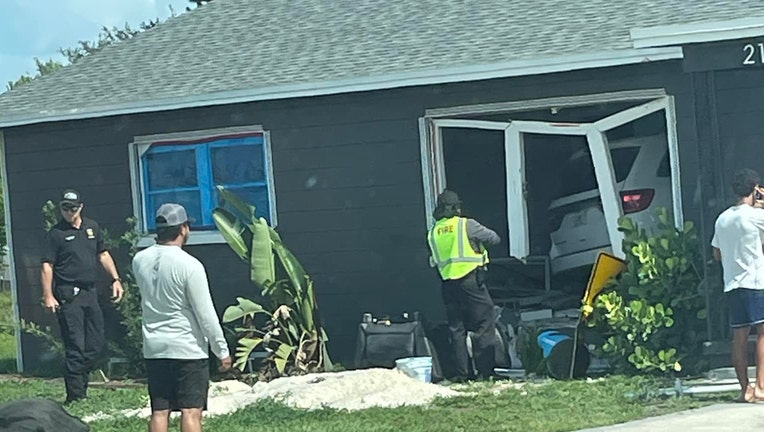 A car slammed into a Lakeland home on Monday and killed one person inside, according to police. Image is courtesy of Crystal Cabello. 