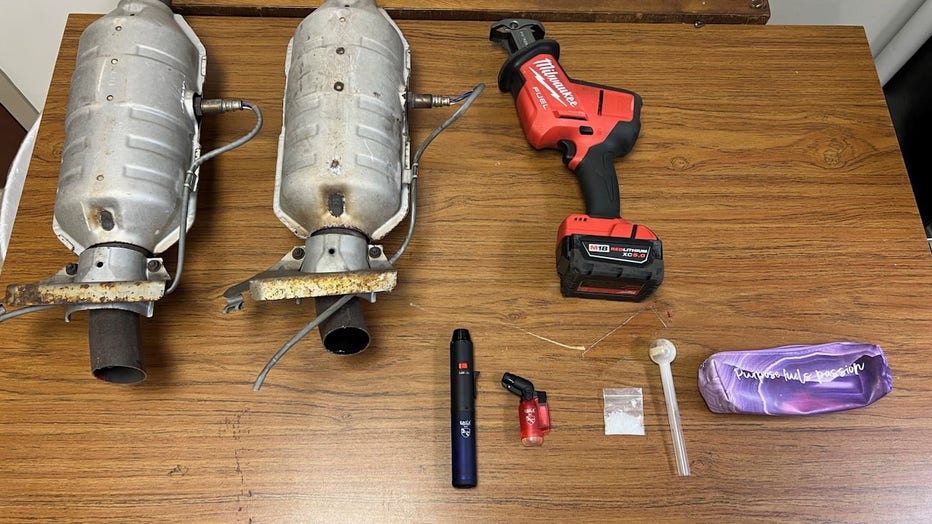 Troopers found two stolen catalytic converters, burglary tools (power drill), crystal methamphetamine, and a glass pipe in Machado Blanco's car.