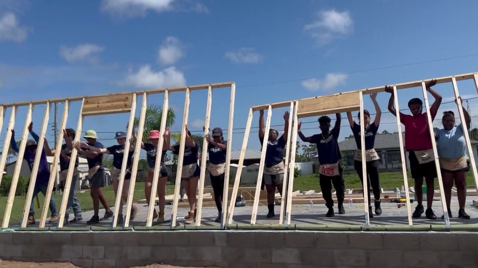 Student volunteers with the Ryan Nece Foundation help build a home with Habitat for Humanity. 