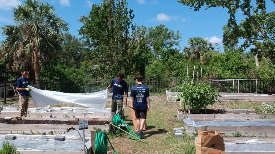 Student volunteers with the Ryan Nece Foundation help rebuild a community garden destroyed by Hurricane Ian. 