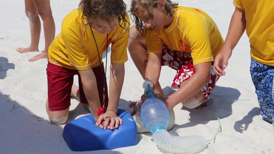 Children learn CPR during lifeguard camp in Clearwater. 