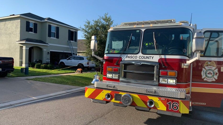 Fire truck outside home where house fire sent 3, including arson suspect to the hospital. Image is courtesy of Pasco County Fire Rescue .