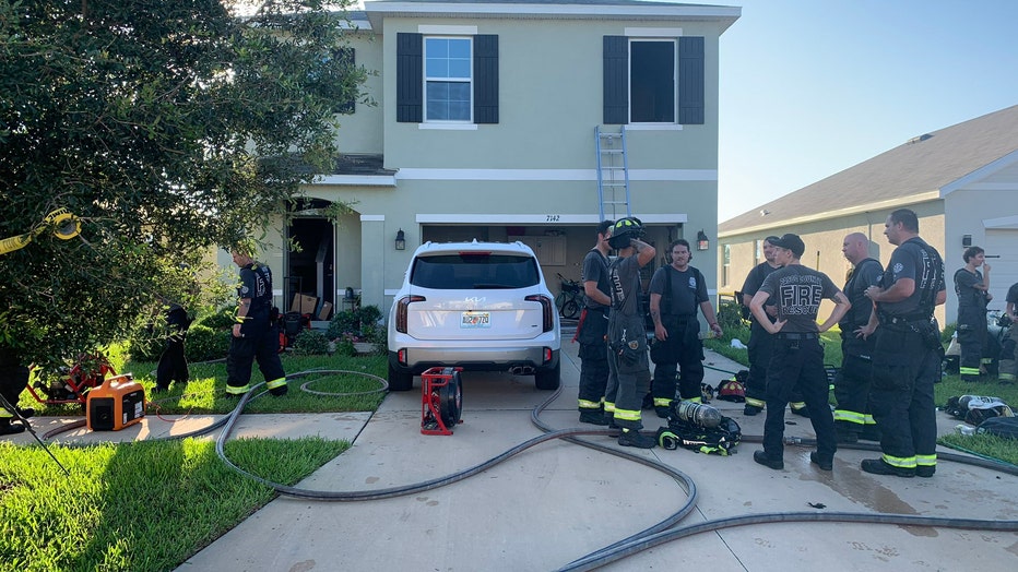 Firefighters outside arson scene in Zephyrhills. Image is courtesy of Pasco County Fire Rescue.