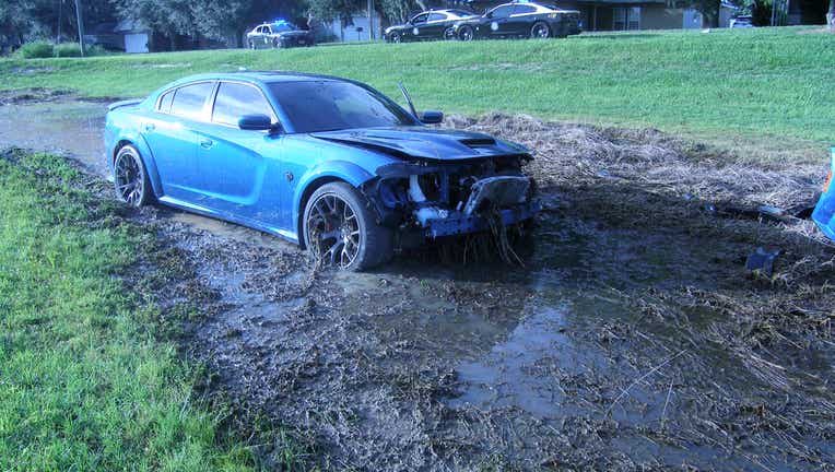 A driver crashed into a pond while trying to get away from law enforcement. Courtesy: Florida Highway Patrol