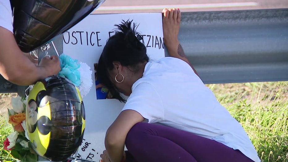 Yitzian Torres Garcia's family kneel at memorial dedicated to the child. 