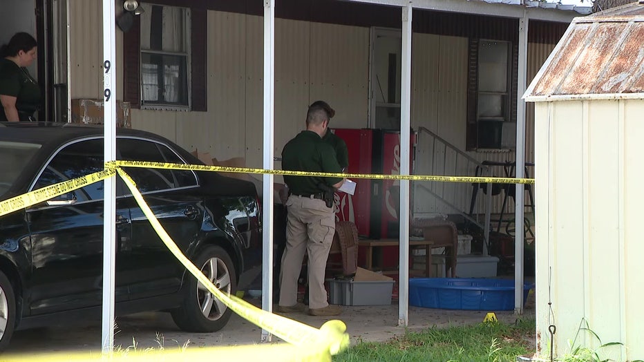 Detective outside a mobile home where an 18-year-old was found dead.