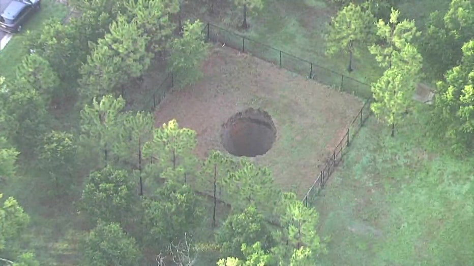 Aerial view of a sinkhole in Seffner that reopened on Monday.