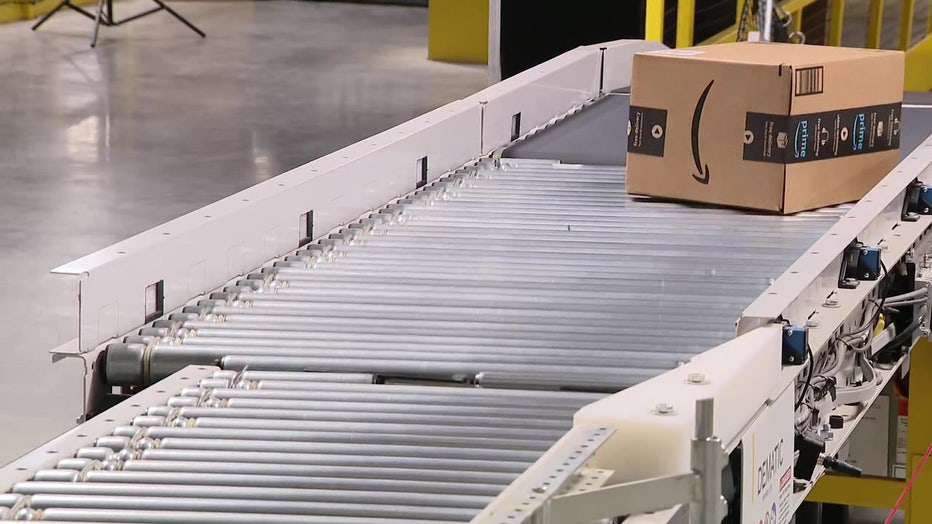 Boxes on conveyor belt at Temple Terrace Amazon warehouse. 