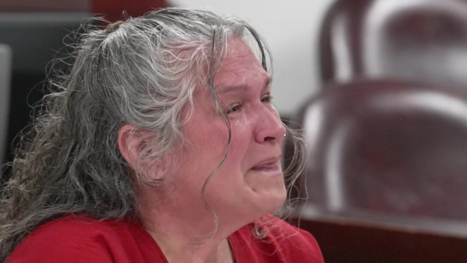 Dee Dee Moore cries in a Tampa courtroom as she seeks a new trial.