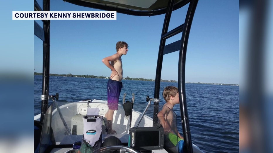 James and Hunter Ganey fishing on boat.