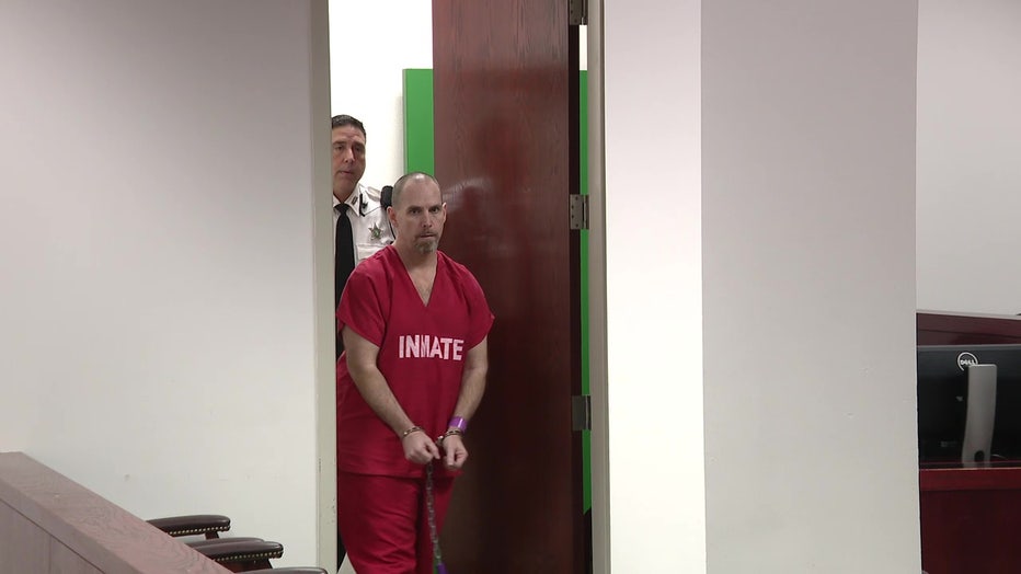 Convicted killer Colin Maloney being led into a Tamp courtroom. 