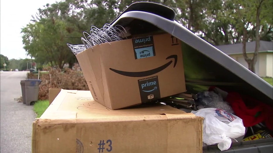 File: Trash piled up in a Polk County garbage can.