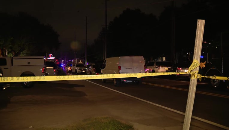 Crime scene tape outside an apartment complex where an alleged gunman was found dead. 