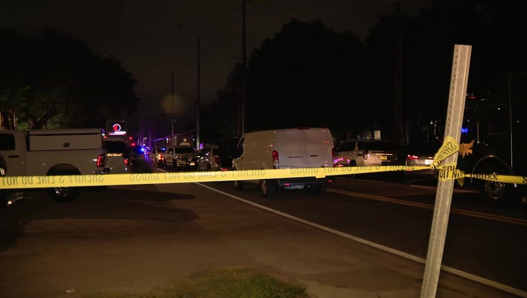 Crime scene tape outside an apartment complex where an alleged gunman was found dead.