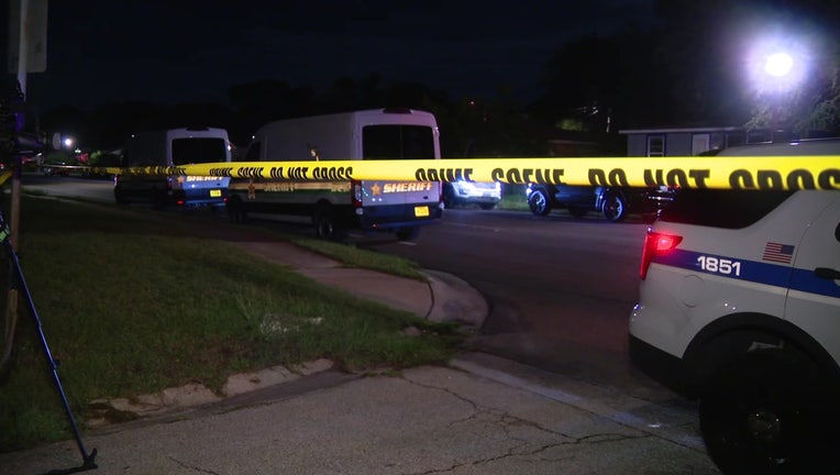 Crime scene tape and law enforcement vehicles at scene of officer-invovled shooting in St. Pete. 