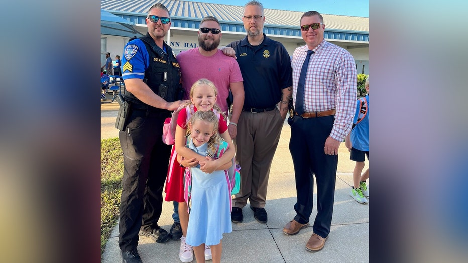 The daughters of Sergeant Lee Cosens were escorted by Bradenton police officers on their first day of school. Image is courtesy of the Bradenton Police Department. 
