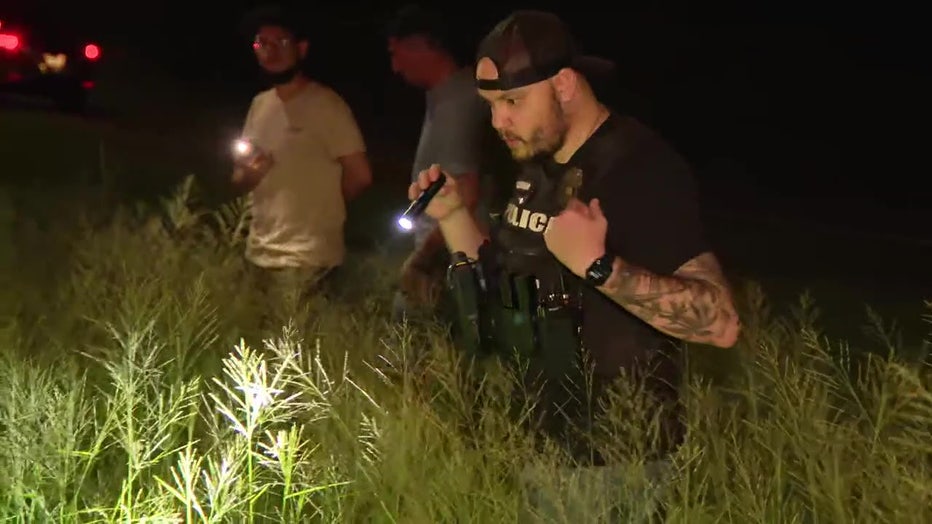 Law enforcement officers search for clues after a child was shot on the Courtney Campbell Causeway. 