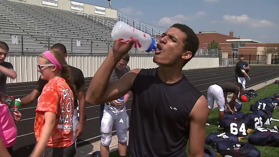 File: Student athlete drinking water. 