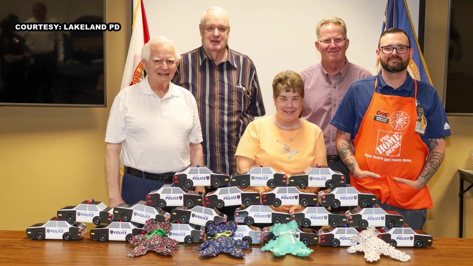 Members of a retirement community make wooden toys for kids. Courtesy: Lakeland PD