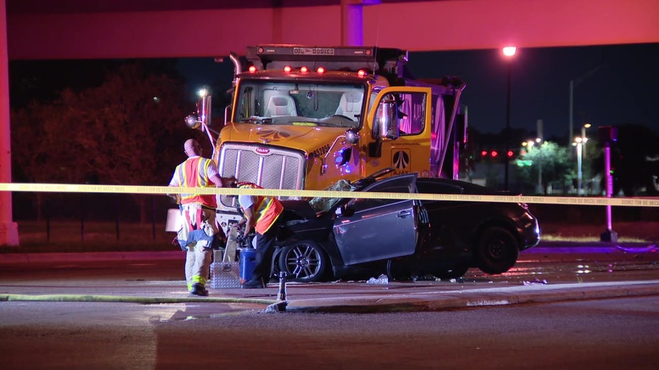 A dump truck and sedan collided early Wednesday morning, according to officers.