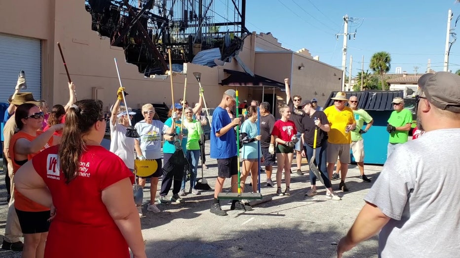 Volunteers help after Hurricane Ian destroyed the Venice Theatre.