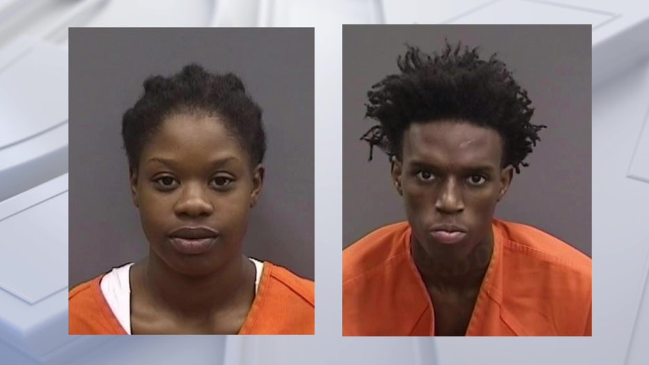 Mugshots of two people accused of robbing a letter carrier in East Tampa.