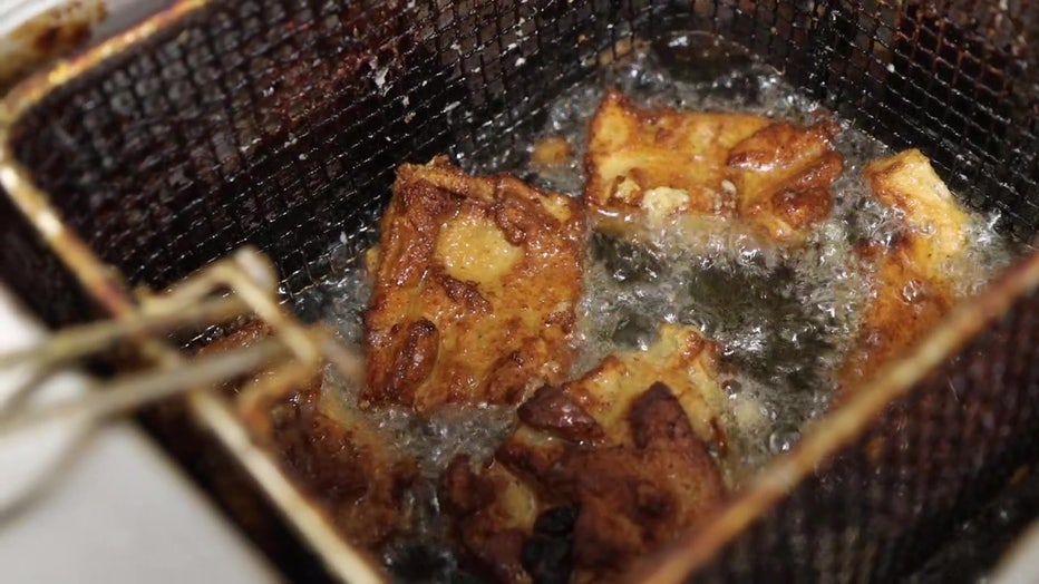 Williams' bread pudding is drizzled with buttered rum and zapped in hot oil.