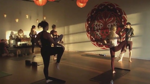 Yoga instructor helping women with fertility issues