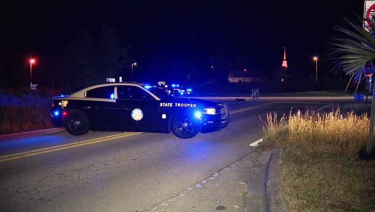 A FHP patrol car at scene of fatal hit-and-run crash. 