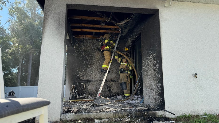 Firefighters work to extinguish fire at Spring Hill home that injured two women. Image is courtesy of Hernando County Fire Rescue.
