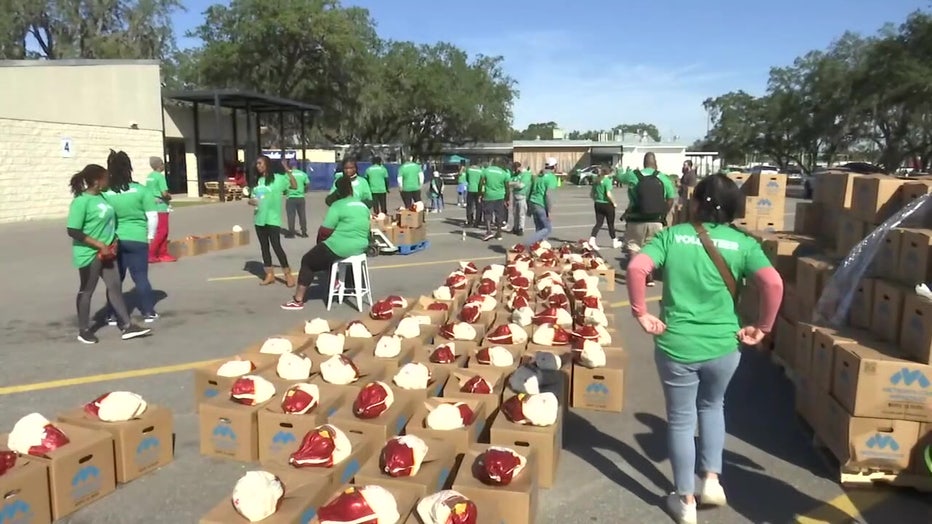 Volunteers alongside dozens of turkeys at Metropolitan Ministries.