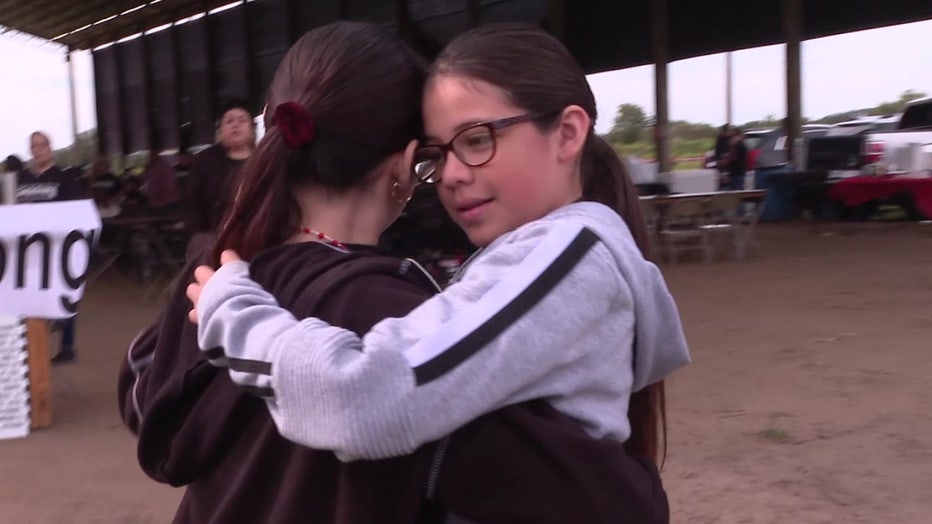 Guillermo Gama's sisters show off the moved he taught them at a fundraiser in his honor. 