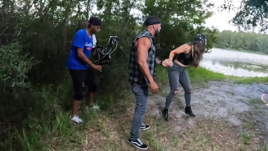 Anthony Capers directs actors during a movie shoot.