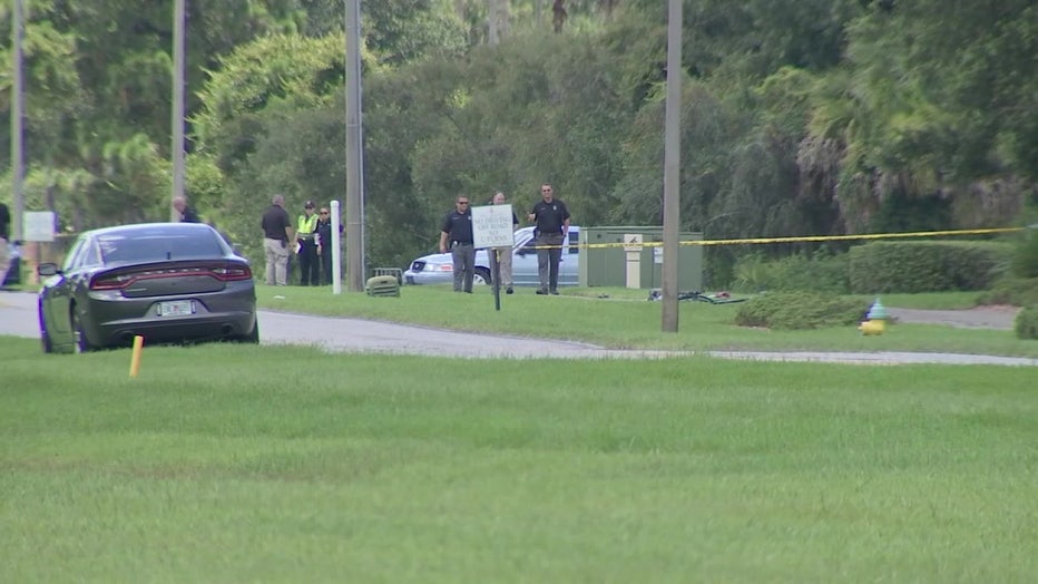 Law enforcement vehicle and crime scene tape at sight of fat hit-and-run in New Tampa. 