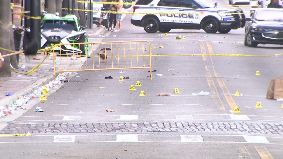 Police car and crime scene tape outside fatal Ybor City shooting.