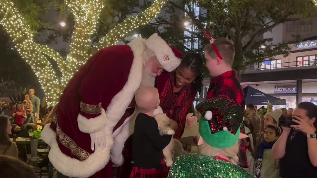 Pediatric cancer patient helps light Hyde Park Christmas tree during fundraiser for Make-A-Wish Foundation