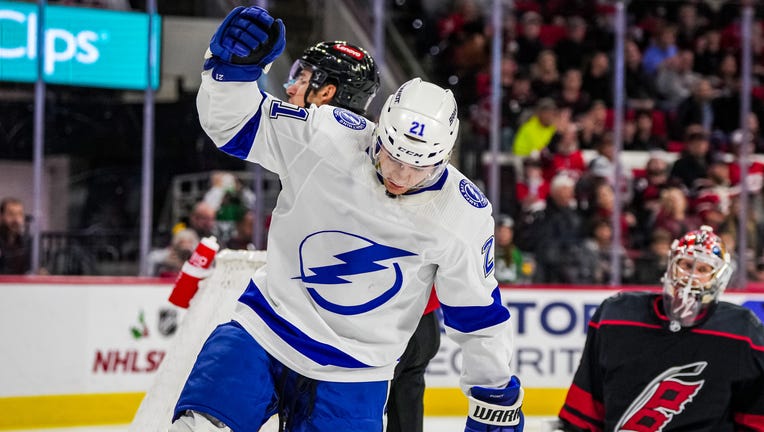 RALEIGH, NORTH CAROLINA - NOVEMBER 24: Brayden Point #21 of the Tampa Bay Lightning celebrates after a goal during the second period against the Carolina Hurricanes at PNC Arena on November 24, 2023 in Raleigh, North Carolina. (Photo by Josh Lavallee/NHLI via Getty Images)
