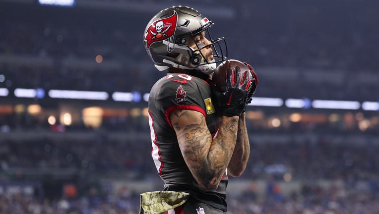 INDIANAPOLIS, INDIANA - NOVEMBER 26: Mike Evans #13 of the Tampa Bay Buccaneers catches the ball in the first half of the game against the Indianapolis Colts at Lucas Oil Stadium on November 26, 2023 in Indianapolis, Indiana. (Photo by Michael Hickey/Getty Images)