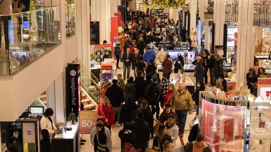 FILE-People shop at Macy's department store during Black Friday in New York City on November 25, 2022. (Photo by Yuki IWAMURA / AFP) (Photo by YUKI IWAMURA/AFP via Getty Images)