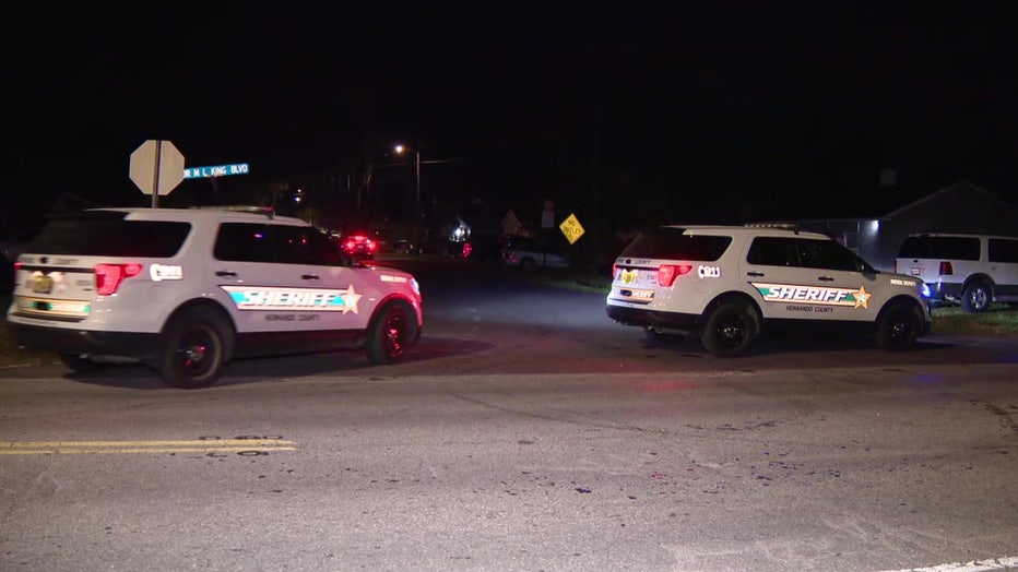 Law enforcement vehicles outside double shooting scene in Brooksville. 