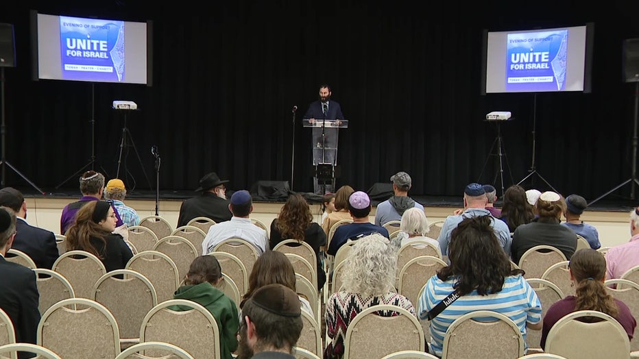 Rabbi Mendy Dubrowski of Chabad Chai South Tampa speaks at a peacefully rally. 