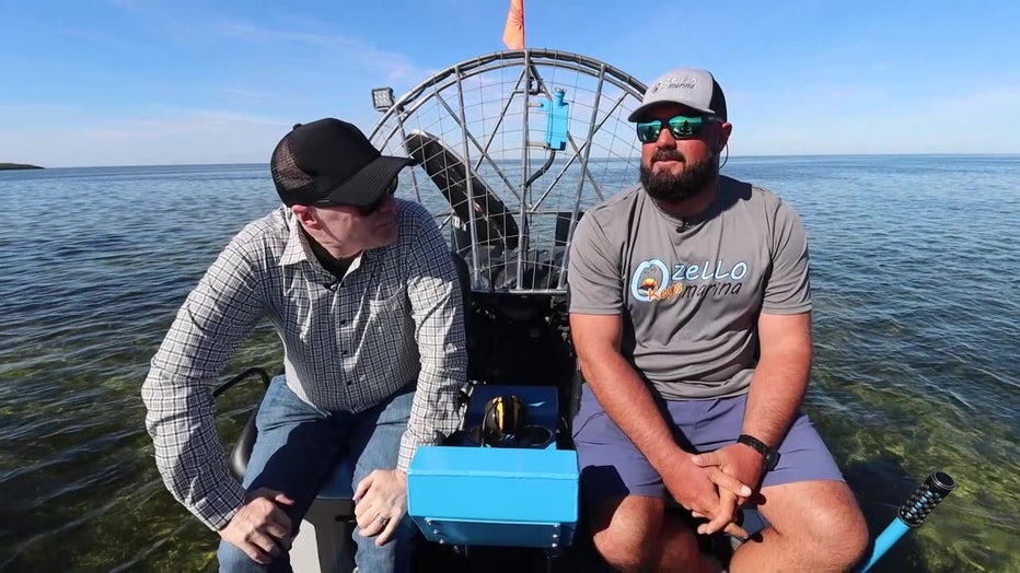 Russell Rhodes and Billy Fender on an airboat in Ozello. 